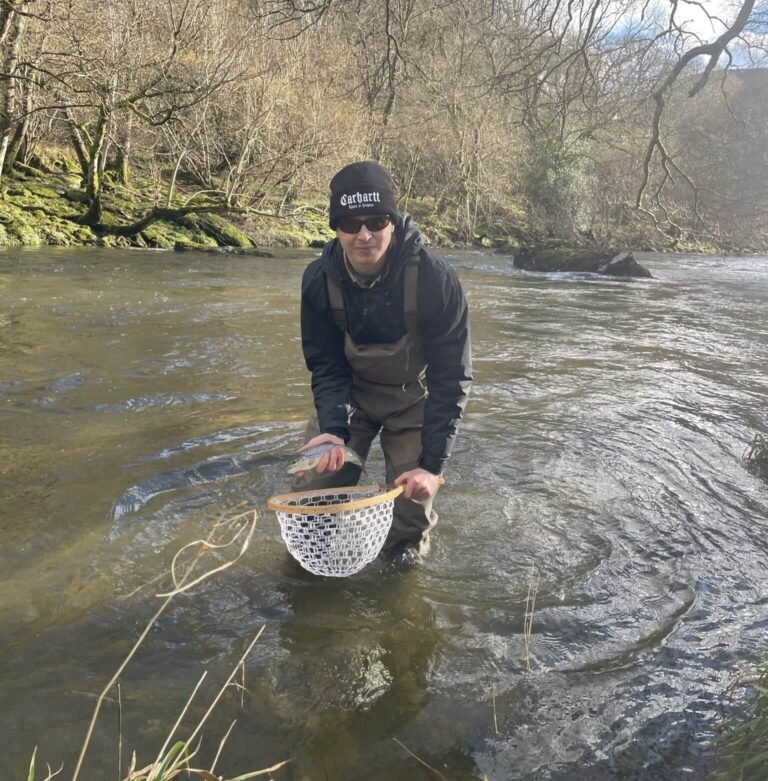 James with a brown trout caught from the upper wye
